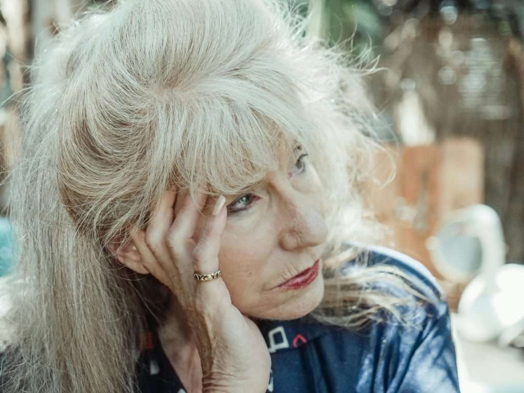 older woman looks off into the distance