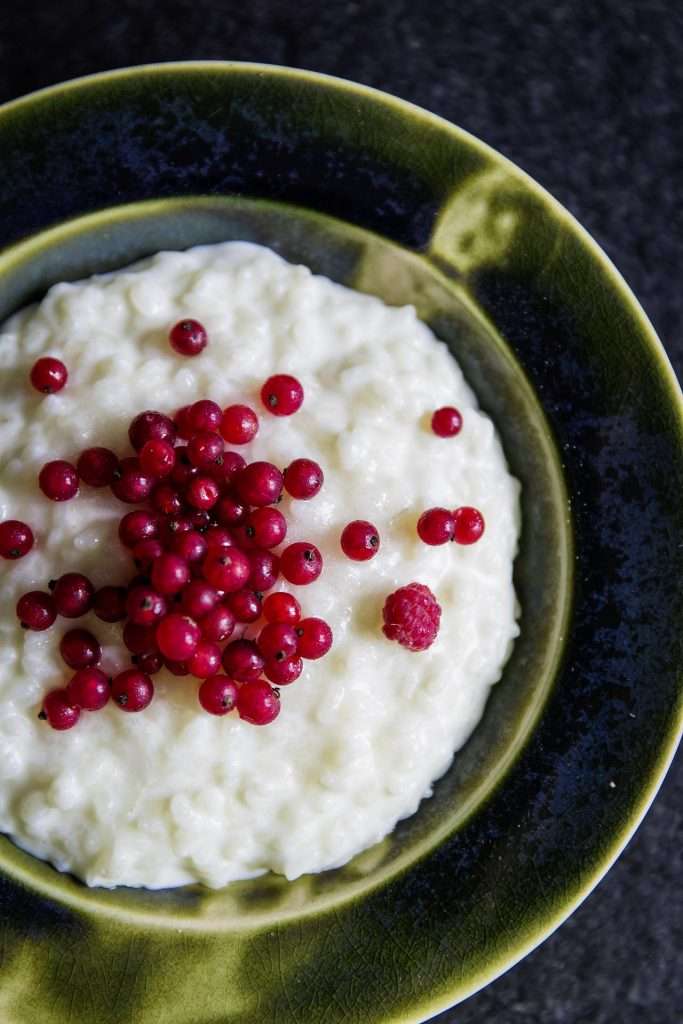 Creamy rice pudding with berries on top