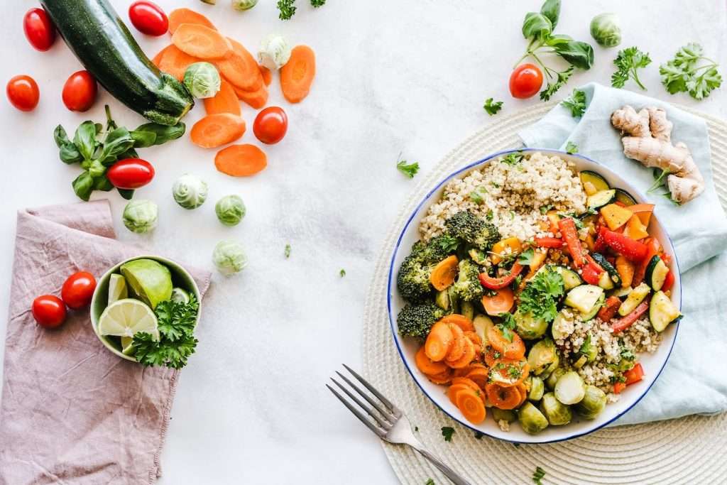 Ginger quinoa bowl with many colorful veggies