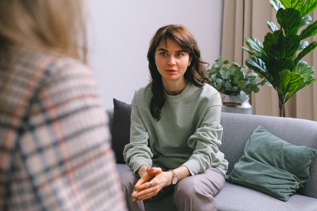 a Woman talks to someone else about a problem