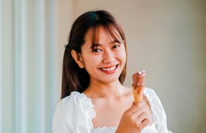 woman holding ice cream cone